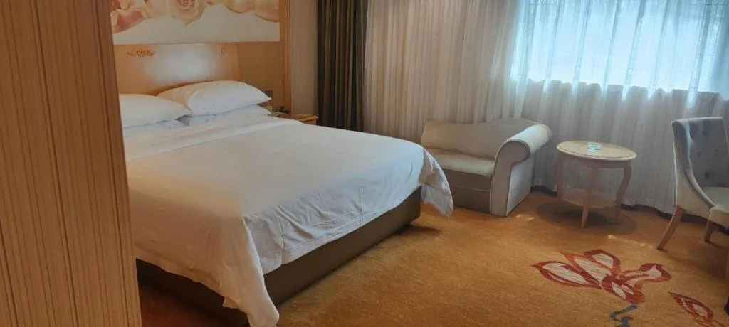 Bed in Vienna Hotel Hunan Jishou Fenghuang Ancient City