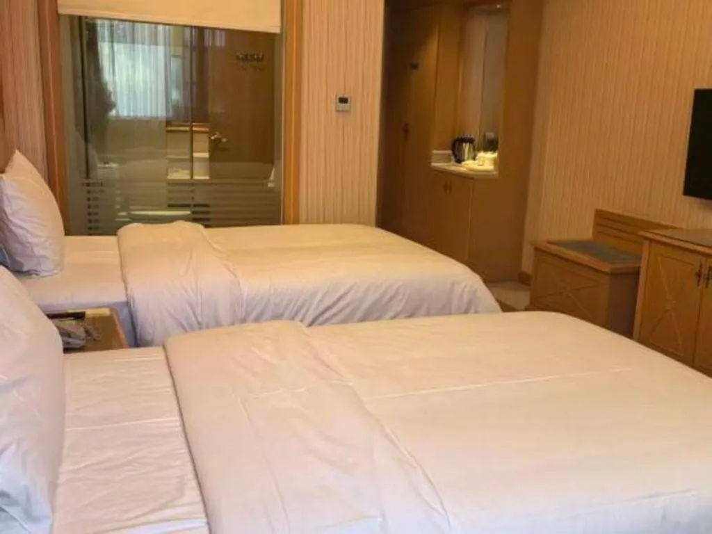 Bed in Vienna Hotel Hunan Jishou Fenghuang Ancient City