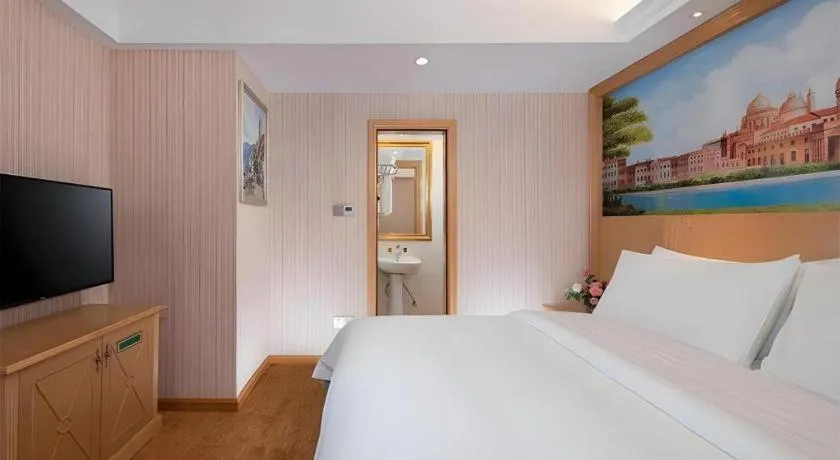 Bed in Vienna Hotel Hunan Jishou Fenghuang Ancient City