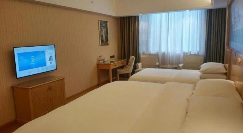 Bed in Vienna Hotel Hunan Jishou Fenghuang Ancient City