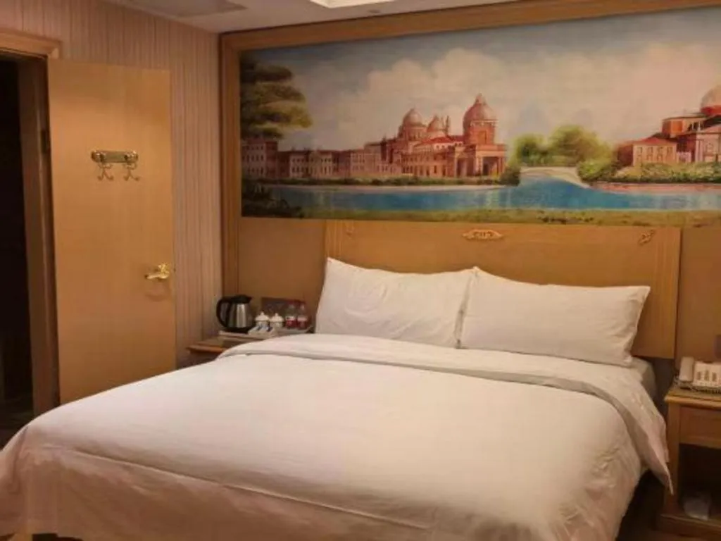 Bed in Vienna Hotel Hunan Jishou Fenghuang Ancient City
