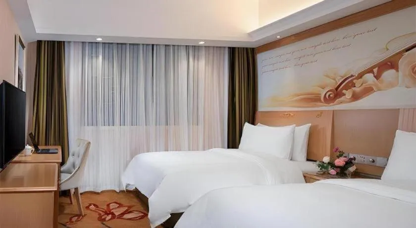 Bed in Vienna Hotel Hunan Jishou Fenghuang Ancient City