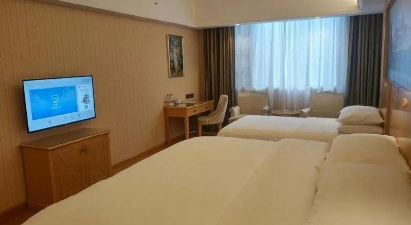 Bed in Vienna Hotel Hunan Jishou Fenghuang Ancient City