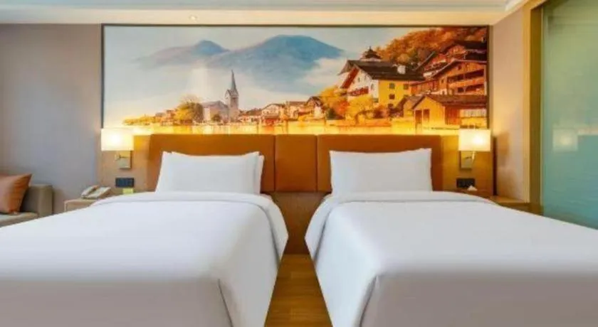 Bed in Vienna Hotel Hunan Jishou Fenghuang Ancient City