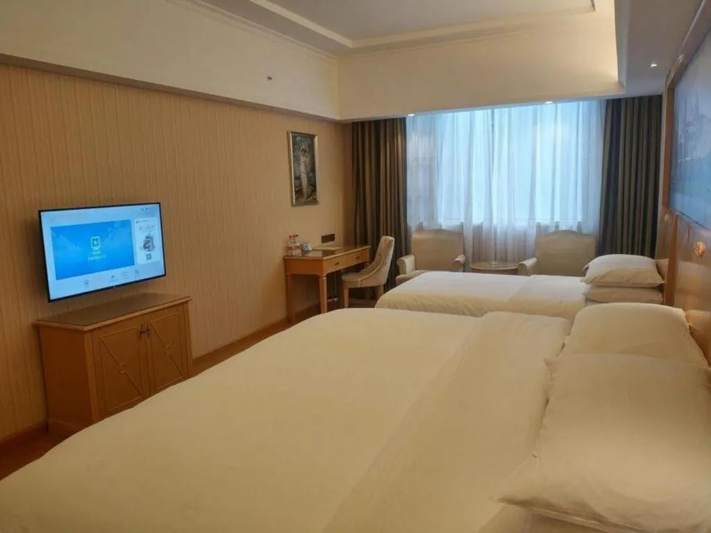 Bed in Vienna Hotel Hunan Jishou Fenghuang Ancient City