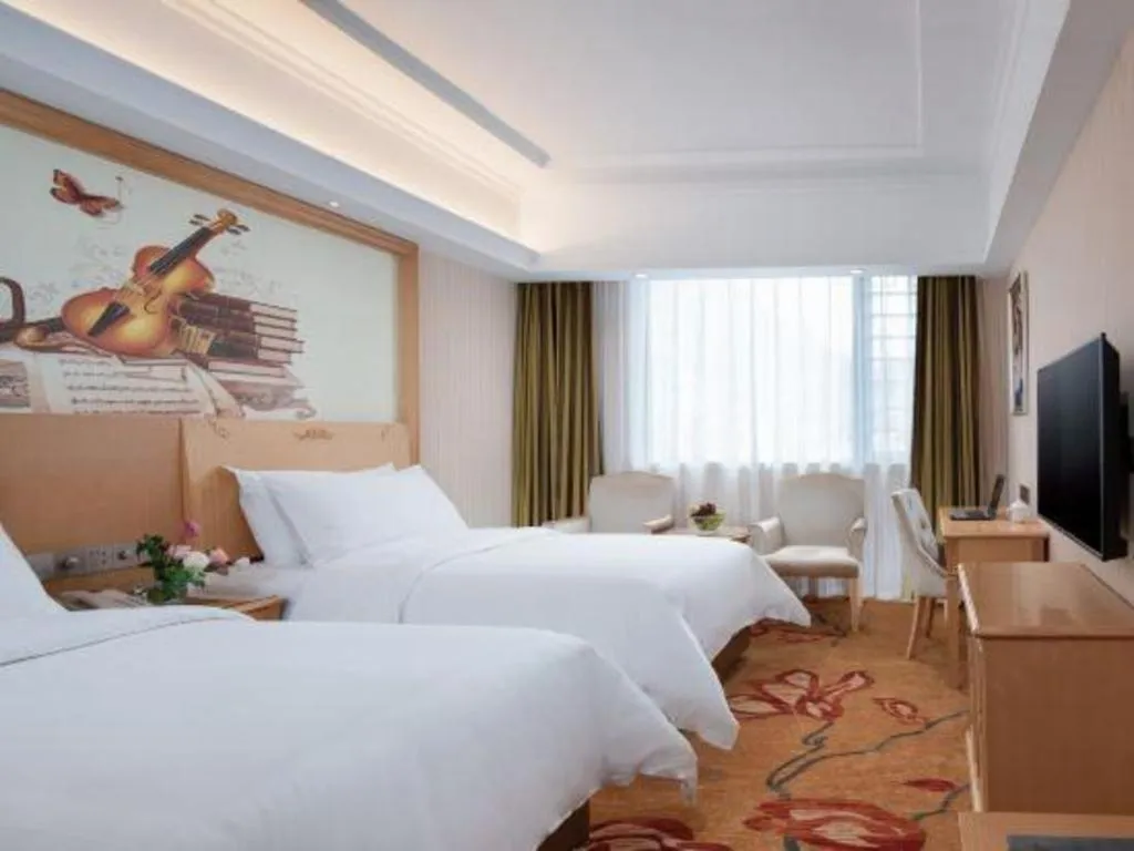 Bed in Vienna Hotel Hunan Jishou Fenghuang Ancient City