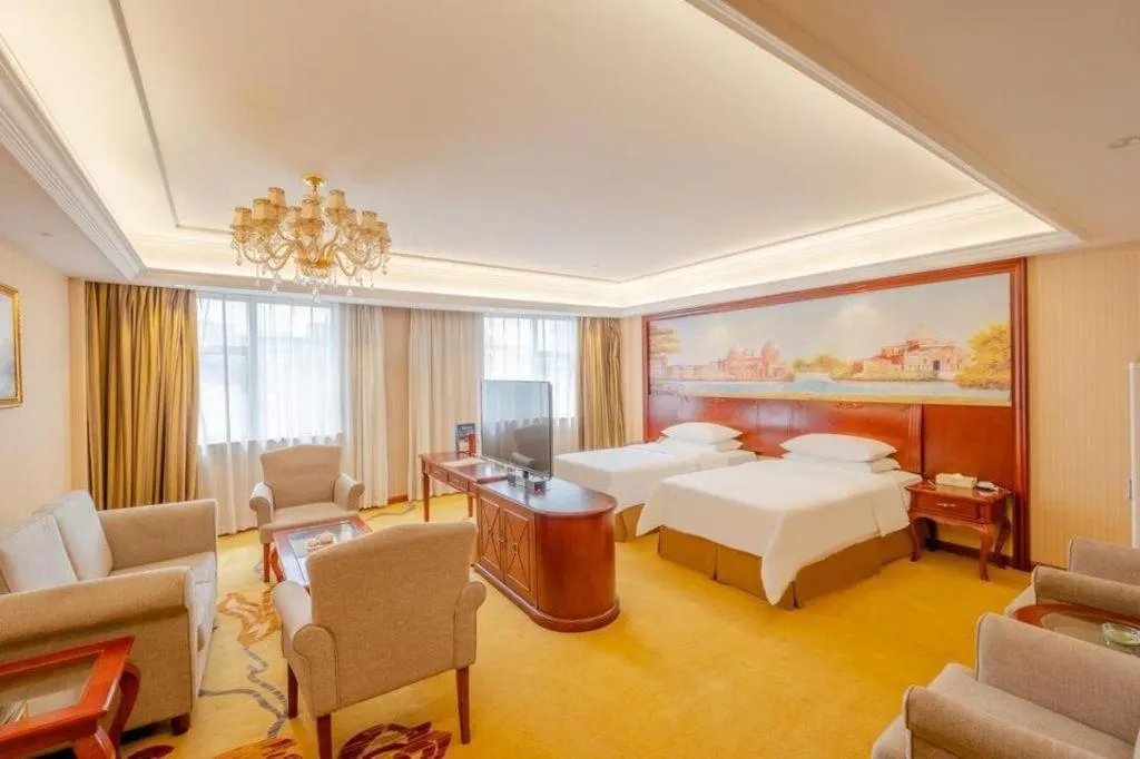 Bed in Vienna Hotel Guangdong Zhongshan Ancient Town Lighting Expo Center