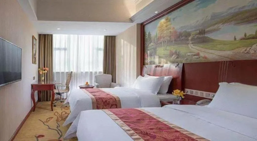 Bed in Vienna Hotel Guangdong Zhongshan Ancient Town Lighting Expo Center