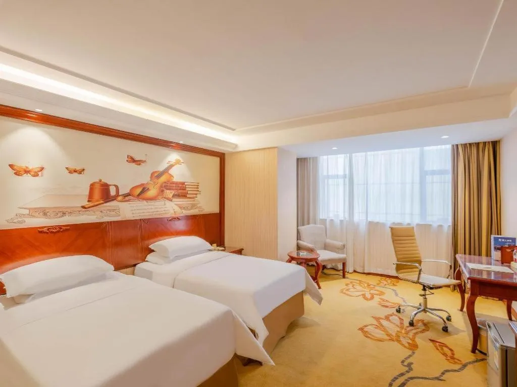 Bed in Vienna Hotel Guangdong Zhongshan Ancient Town Lighting Expo Center