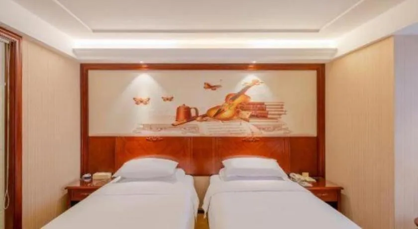 Bed in Vienna Hotel Guangdong Zhongshan Ancient Town Lighting Expo Center