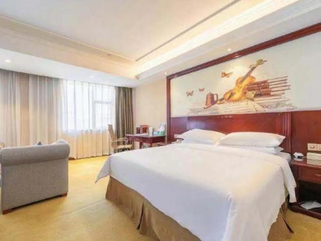 Bed in Vienna Hotel Guangdong Zhongshan Ancient Town Lighting Expo Center