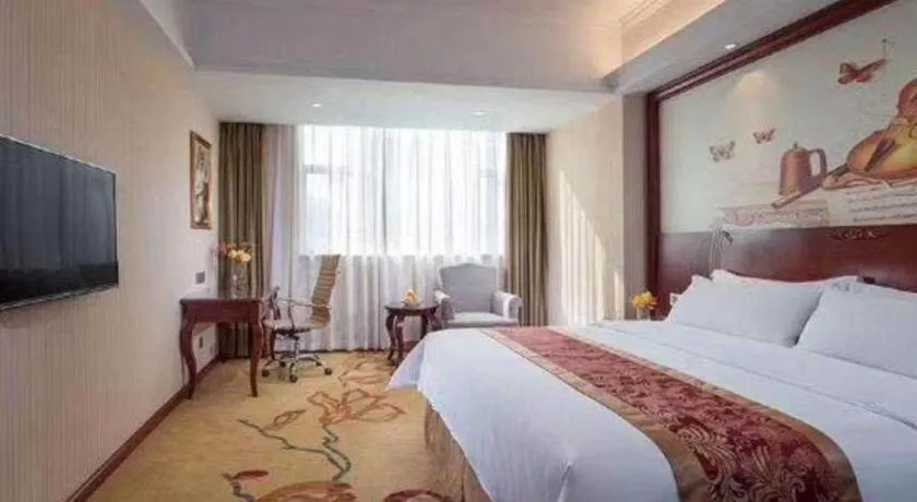 Bed in Vienna Hotel Guangdong Zhongshan Ancient Town Lighting Expo Center