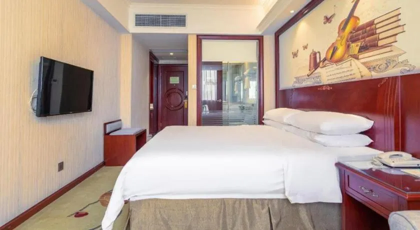 Bed in Vienna Hotel Guangdong Zhongshan Ancient Town Lighting Expo Center
