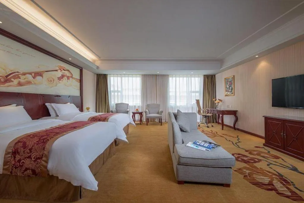 Bed in Vienna Hotel Guangdong Zhongshan Ancient Town Lighting Expo Center