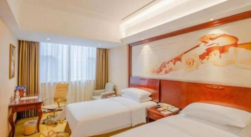 Bed in Vienna Hotel Guangdong Zhongshan Ancient Town Lighting Expo Center