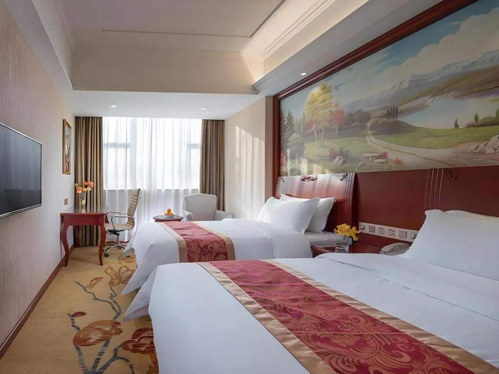 Bed in Vienna Hotel Guangdong Zhongshan Ancient Town Lighting Expo Center