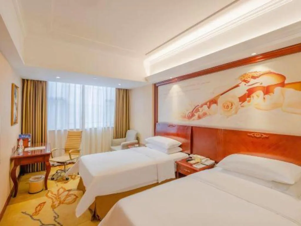 Bed in Vienna Hotel Guangdong Zhongshan Ancient Town Lighting Expo Center