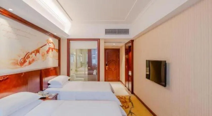 Bed in Vienna Hotel Guangdong Zhongshan Ancient Town Lighting Expo Center