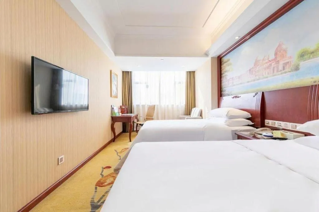 Bed in Vienna Hotel Guangdong Zhongshan Ancient Town Lighting Expo Center
