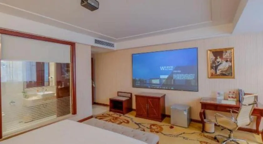 Bed in Vienna Hotel Guangdong Zhongshan Ancient Town Lighting Expo Center