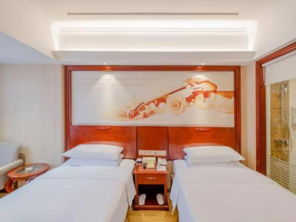 Bed in Vienna Hotel Guangdong Zhongshan Ancient Town Lighting Expo Center