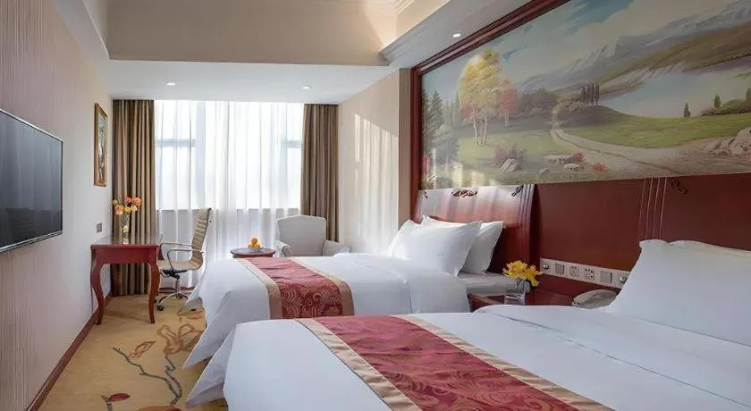 Bed in Vienna Hotel Guangdong Zhongshan Ancient Town Lighting Expo Center