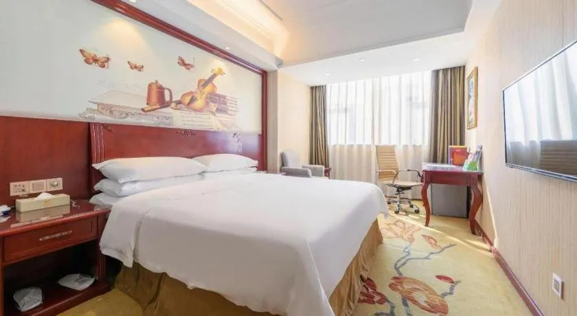Bed in Vienna Hotel Guangdong Zhongshan Ancient Town Lighting Expo Center