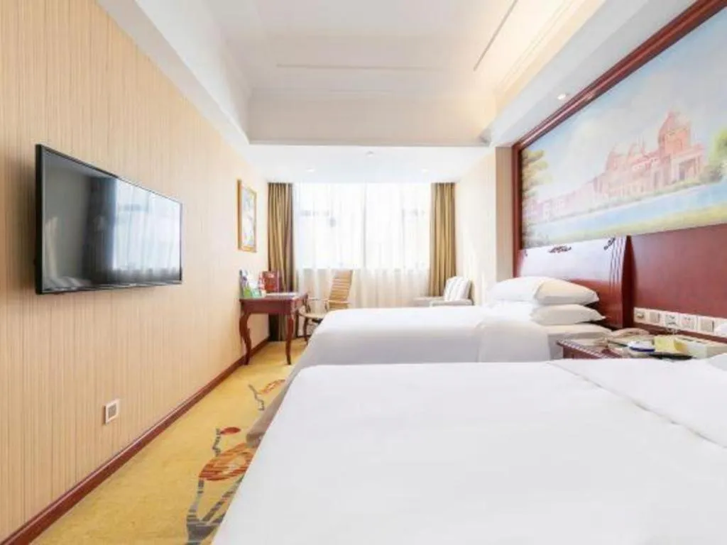 Bed in Vienna Hotel Guangdong Zhongshan Ancient Town Lighting Expo Center