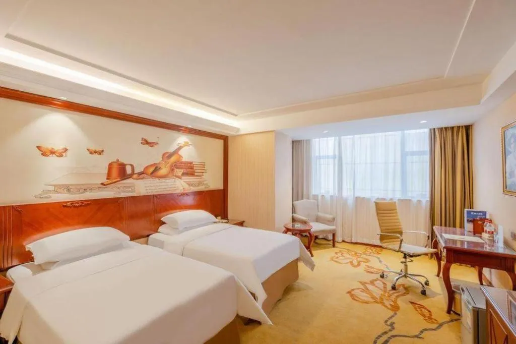 Bed in Vienna Hotel Guangdong Zhongshan Ancient Town Lighting Expo Center