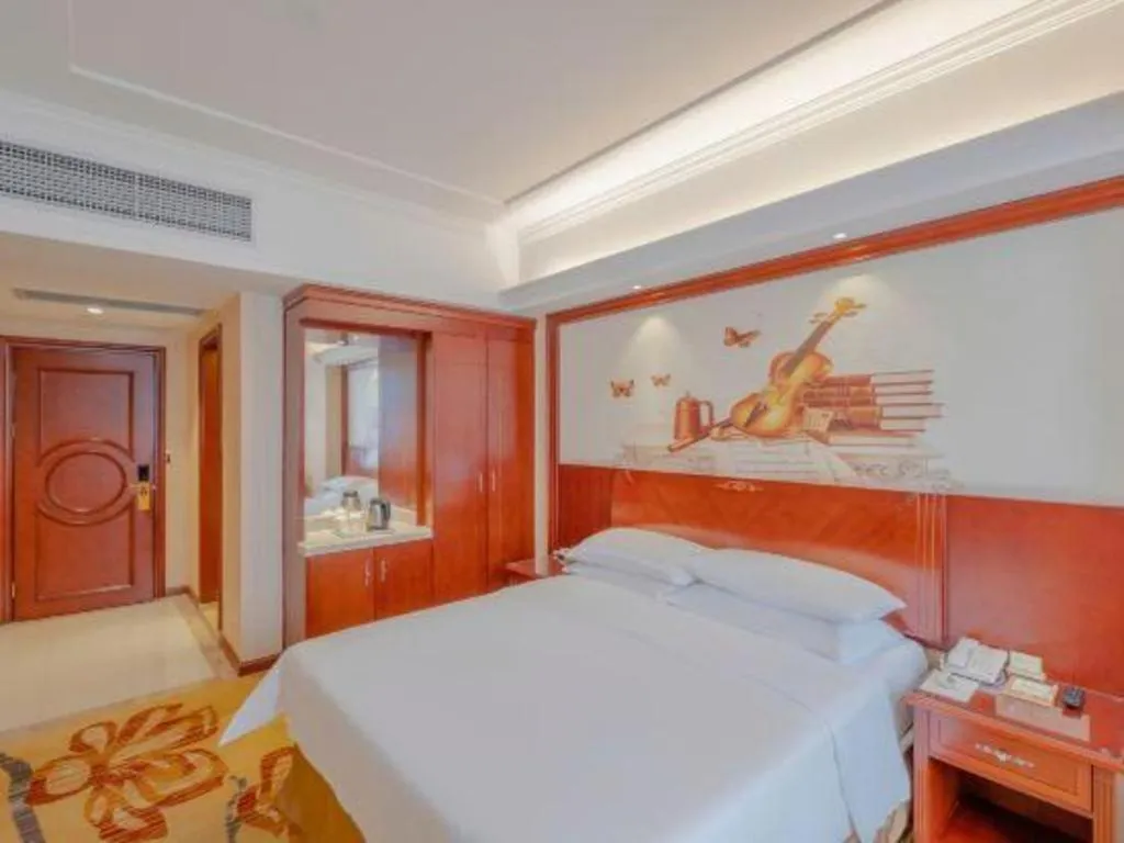 Bed in Vienna Hotel Guangdong Zhongshan Ancient Town Lighting Expo Center