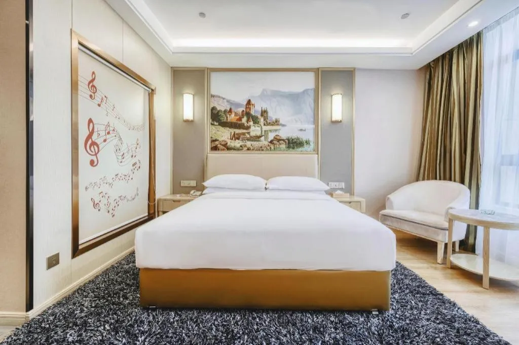 Bed in Vienna Hotel Fujian Fuqing Wanda Plaza