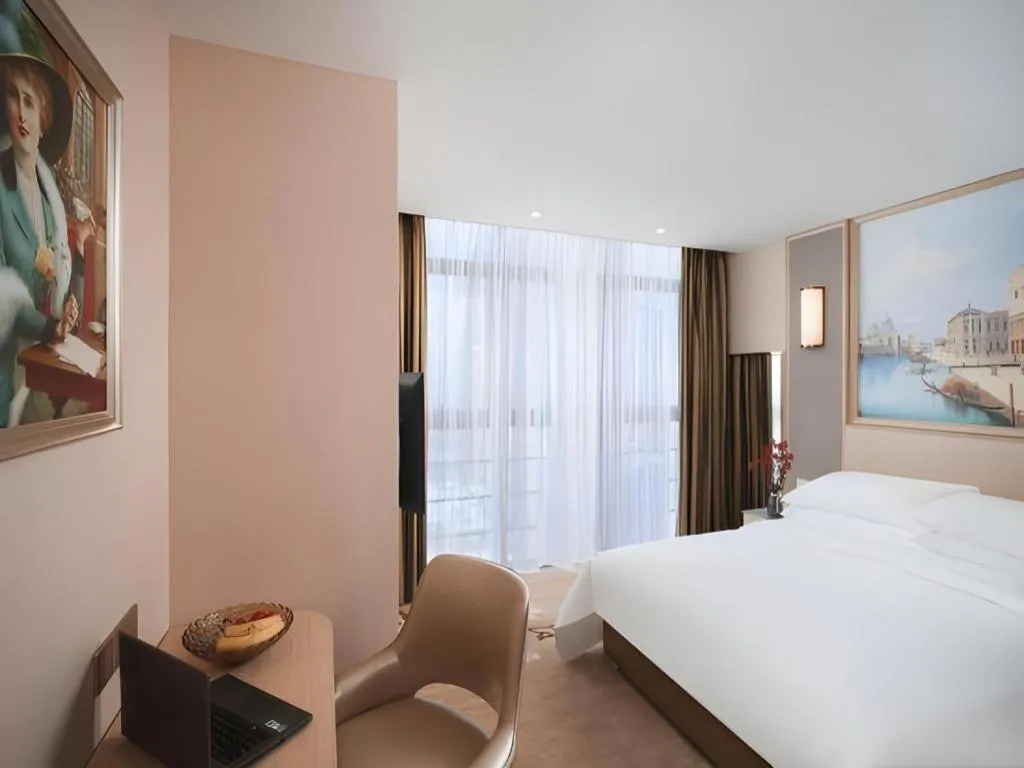 Bed in Vienna Hotel Fujian Fuqing Wanda Plaza