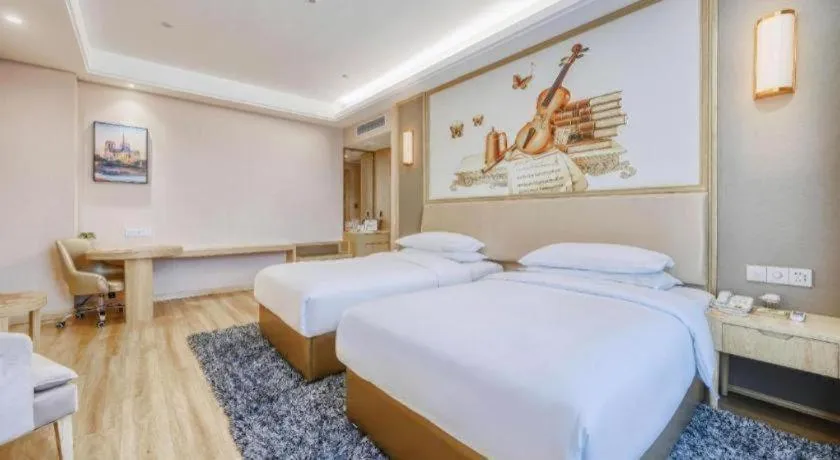 Bed in Vienna Hotel Fujian Fuqing Wanda Plaza