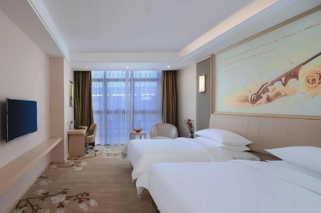 Bed in Vienna Hotel Fujian Fuqing Wanda Plaza