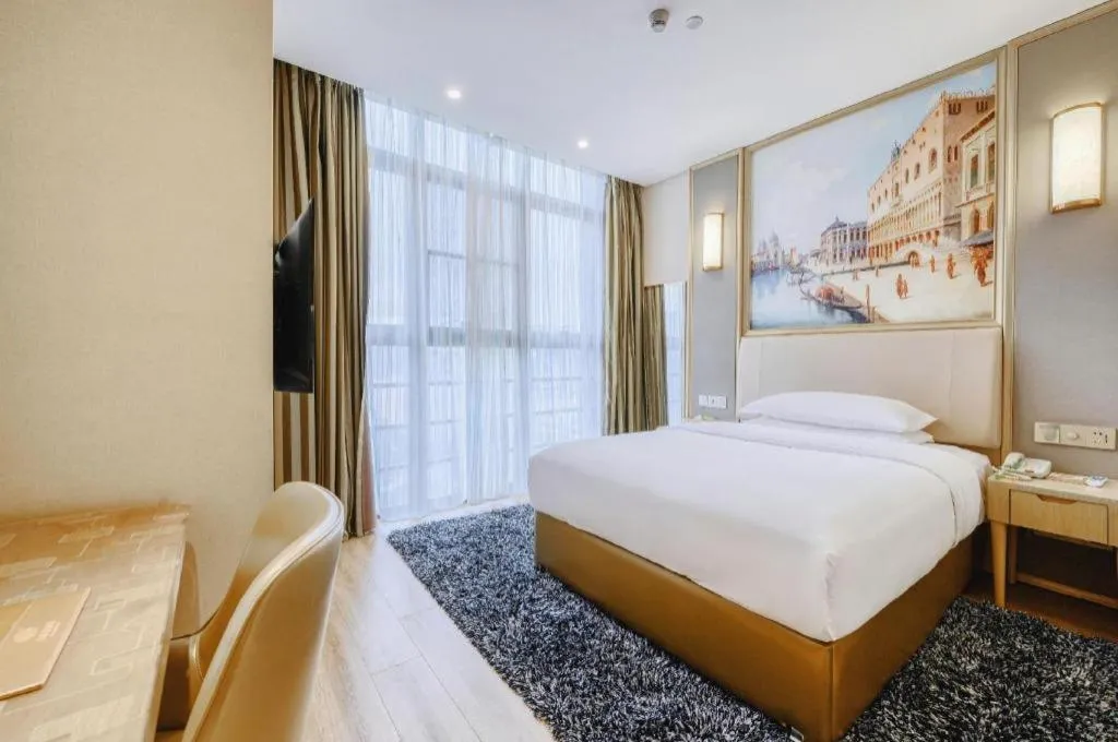Bed in Vienna Hotel Fujian Fuqing Wanda Plaza