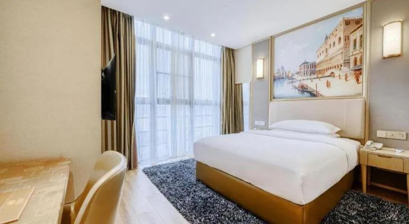Bed in Vienna Hotel Fujian Fuqing Wanda Plaza