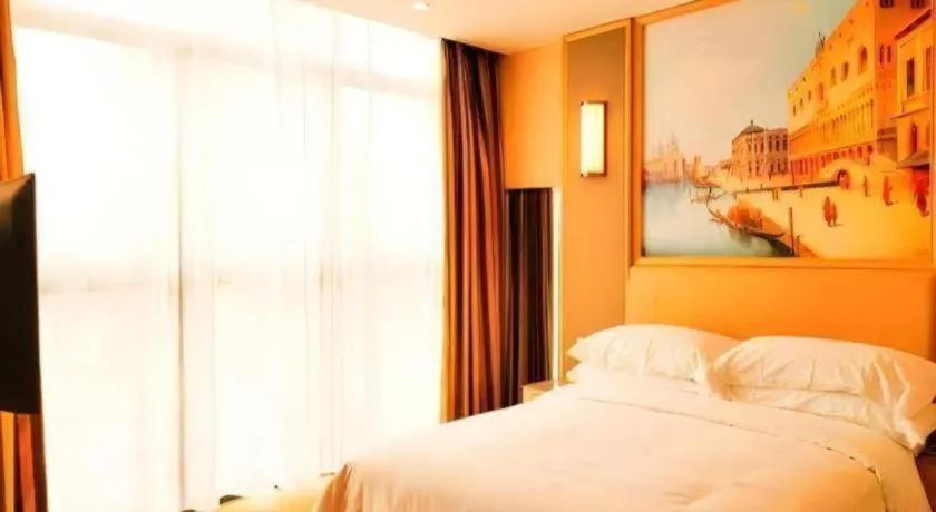 Bed in Vienna Hotel Fujian Fuqing Wanda Plaza