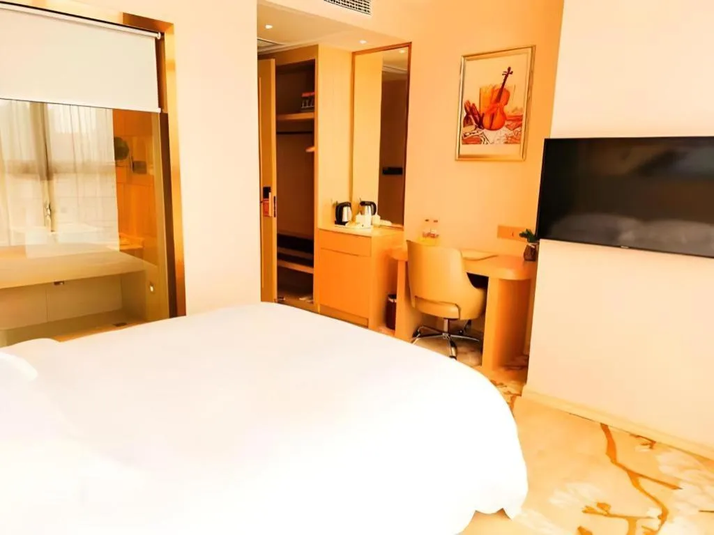 Bed in Vienna Hotel Fujian Fuqing Wanda Plaza