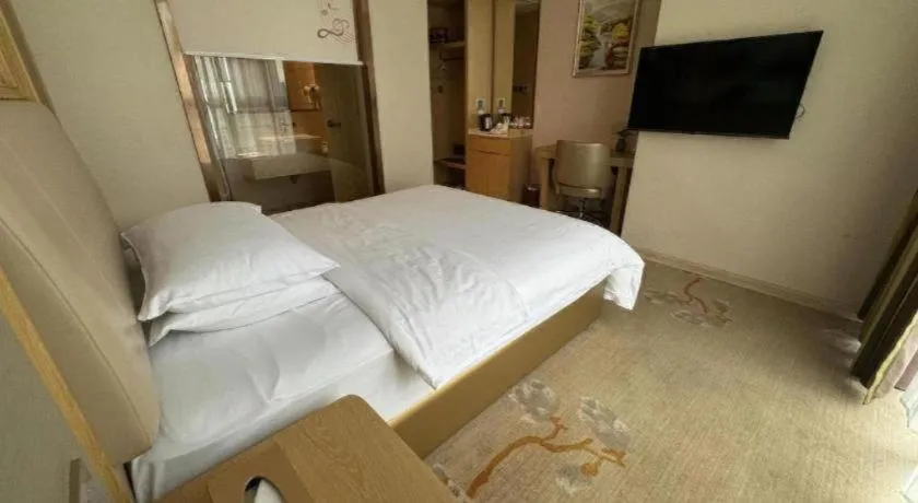 Bed in Vienna Hotel Fujian Fuqing Wanda Plaza