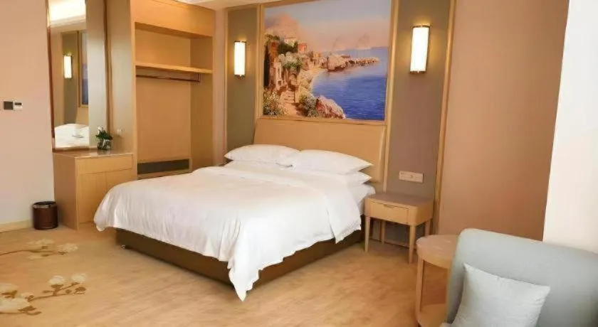 Bed in Vienna Hotel Fujian Fuqing Wanda Plaza