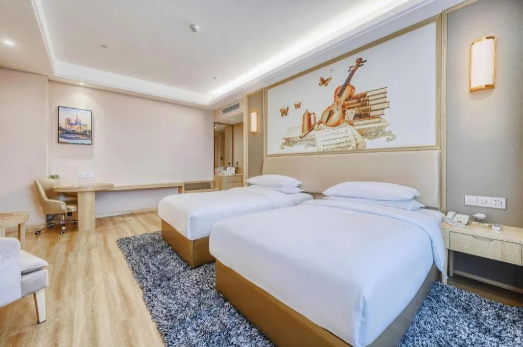 Bed in Vienna Hotel Fujian Fuqing Wanda Plaza