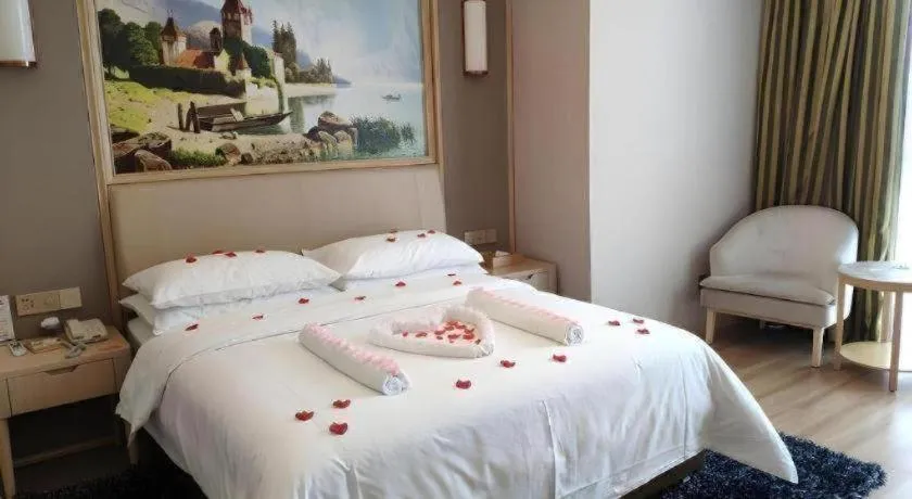 Bed in Vienna Hotel Fujian Fuqing Wanda Plaza