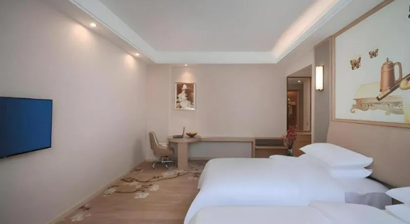 Bed in Vienna Hotel Fujian Fuqing Wanda Plaza