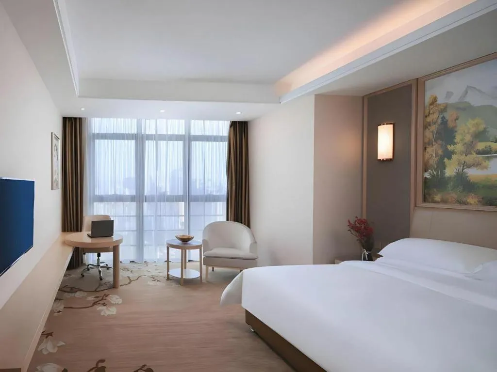 Bed in Vienna Hotel Fujian Fuqing Wanda Plaza