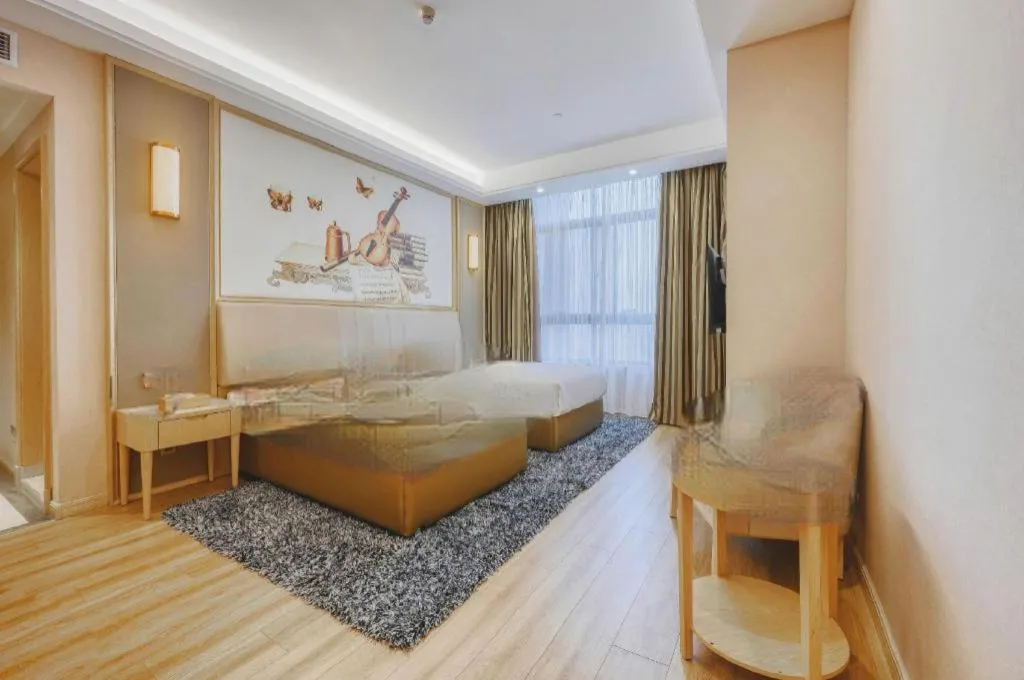 Bed in Vienna Hotel Fujian Fuqing Wanda Plaza