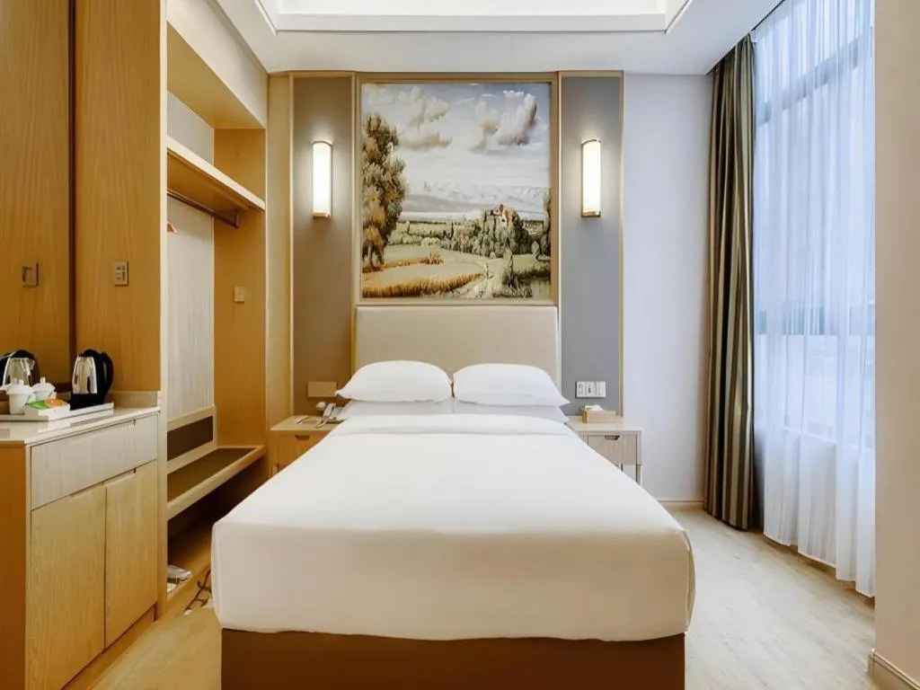 Bed in Vienna Hotel Fujian Fuqing Wanda Plaza