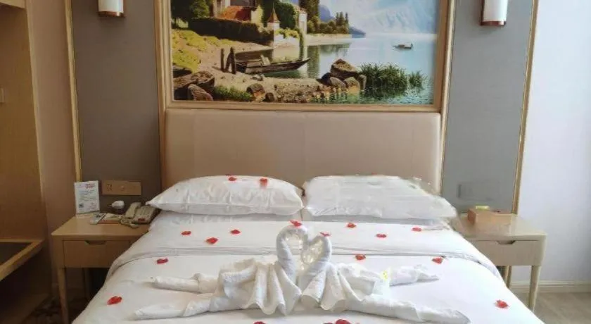 Bed in Vienna Hotel Fujian Fuqing Wanda Plaza