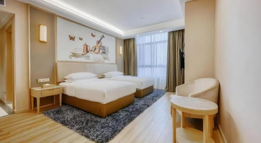 Bed in Vienna Hotel Fujian Fuqing Wanda Plaza