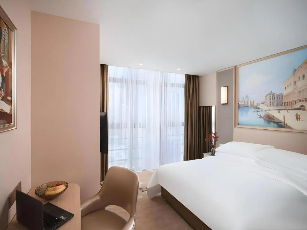 Bed in Vienna Hotel Fujian Fuqing Wanda Plaza