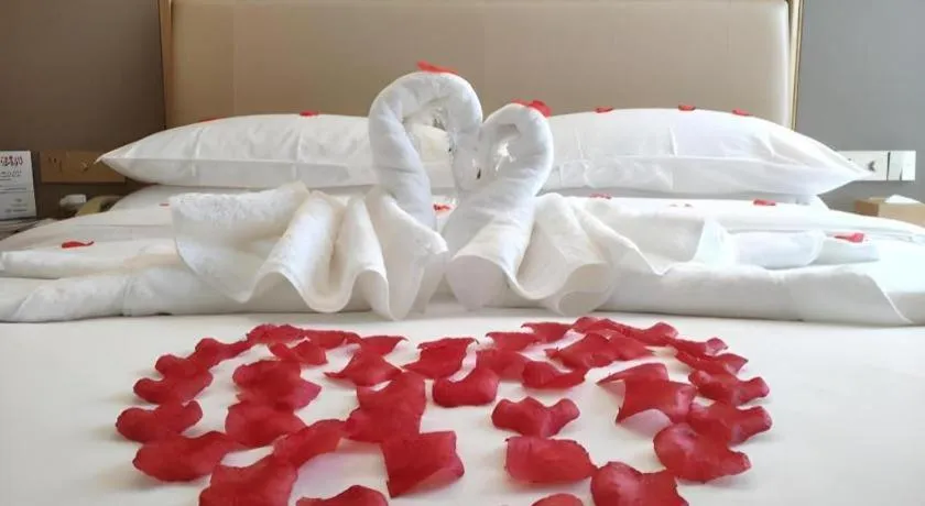 Bed in Vienna Hotel Fujian Fuqing Wanda Plaza